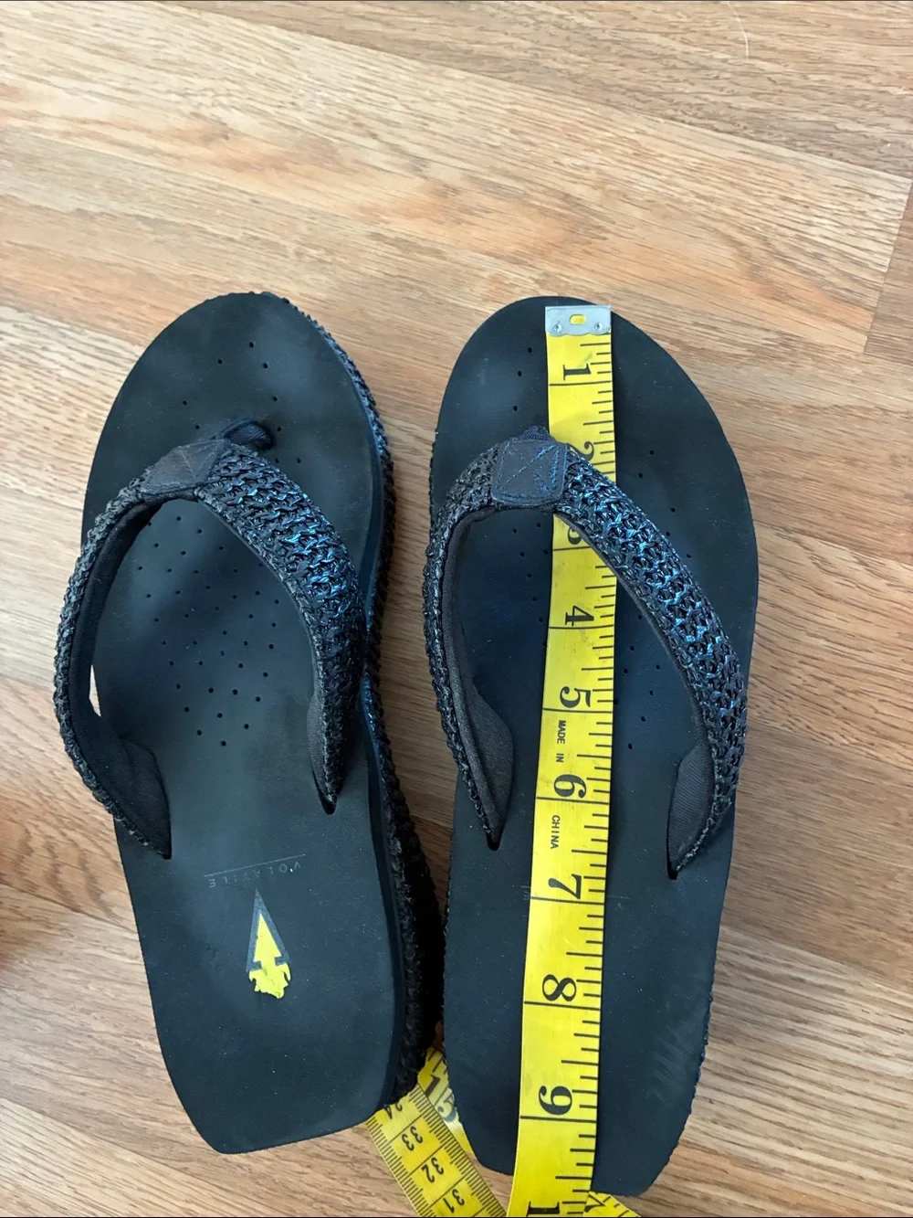 Volatile Black Braided Strap Thong Sandals with Yellow Logo